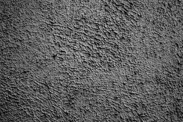Abstract black background. Black stucco texture. Dark rough surface.