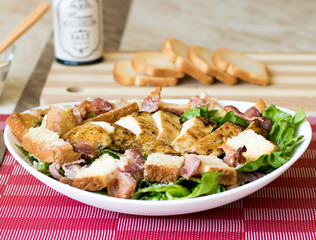 cesar salad with fresh vegetables and roast chicken