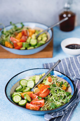 Vegetarian salad with fresh vegetables and sesame sauce