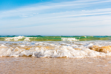 Bursts of sea waves on a tropical sea beach,