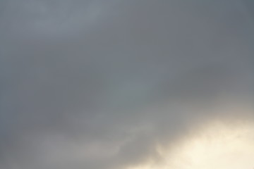 Sky with clouds seen against the sun