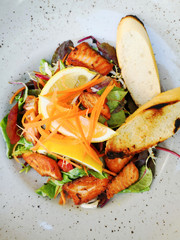 grilled salmon and lemon - french cuisine dish with tomato and salmon