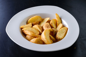 rustic potatoes in a white plate