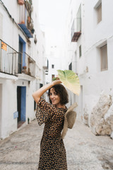 young woman on the streets of the old town of Peniscola, Spain