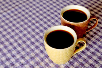 Two Cups of Hot Black Coffee Isolated on the Table with Copy Space