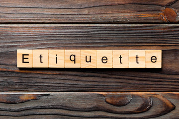ETIQUETTE word written on wood block. ETIQUETTE text on wooden table for your desing, concept - obrazy, fototapety, plakaty