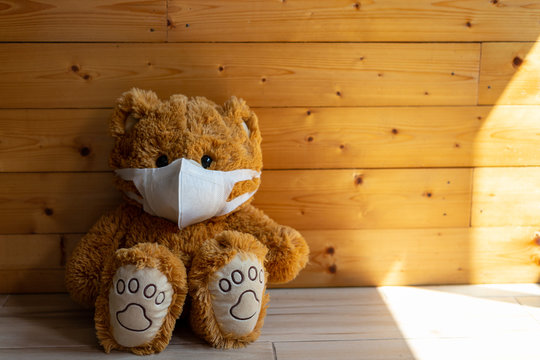 sick teddy bear is wearing a virus protection mask Covid-19 ,Health care concept.