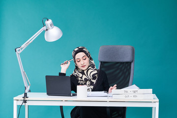 Office Lady with bundle of file on the table and laptop