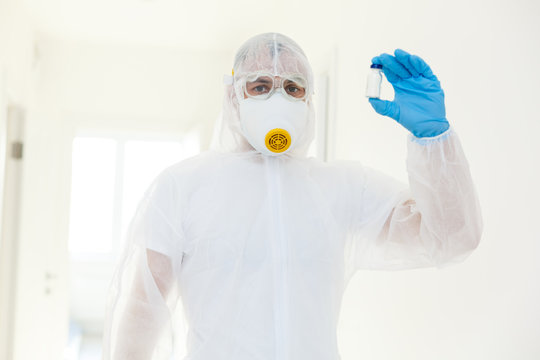 Man scientists wear protective clothing. on a white background