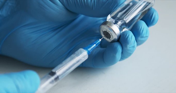 Crop shot of doctor preparing vaccine for injection