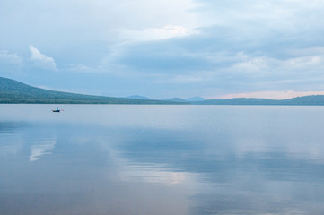 Beautiful blue lake and sky reflection, smooth surface of water