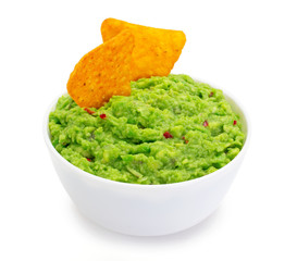 Bowl of guacamole with nachos