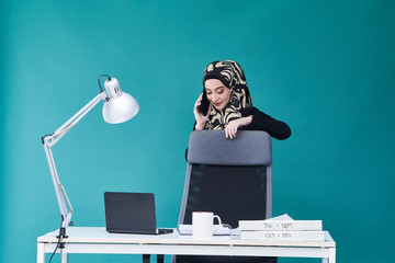 Office Lady with bundle of file on the table and laptop