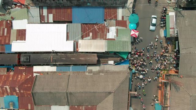 Maeklong Railway Market (Talad Rom Hub), Crowd at the end of the platform with Aerial view. Thailand.