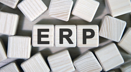 The concept of ERP - Enterprise Resource Planning. Wooden cubes and many cubes around