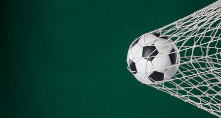 goal net, soccer ball in goal, green background