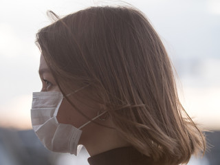 Beautiful Girl Wearing Medical Mask During Coronavirus COVID-19 Epidemic