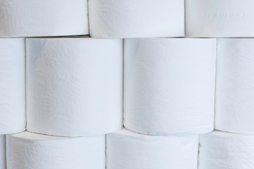 White toilet paper rolls stacked on top of each other.Basic hygiene article shortage in UK shops due to outbreak of coronavirus. 