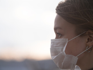 Beautiful Girl Wearing Medical Mask During Coronavirus COVID-19 Epidemic