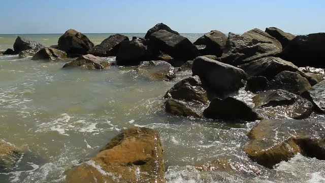 Stones on the black sea with waves in Odessa region