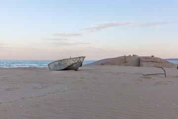 Beautiful landscape of rusty boat on the beach in sunrise. Vintage Boat in the seashore. Kazakstan, Caspian Sea