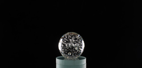 magic glass ball isolated on black background