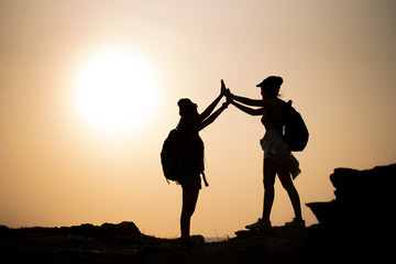 Fototapeta premium Two young Asian female hiking on mountain holiday, wild adventure. Background for Travel concept