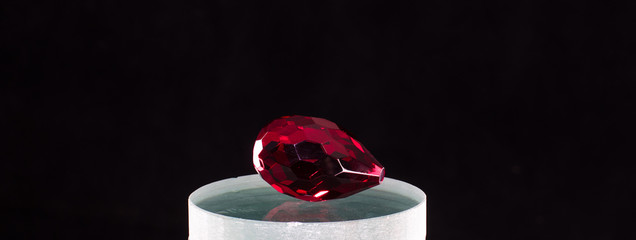 ruby gemstone isolated on black background