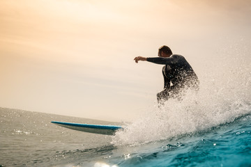 Surfer riding waves on the island of fuerteventura