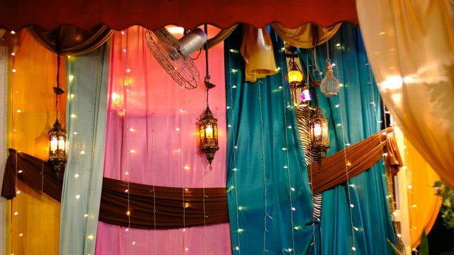 Arabic lamps and lanterns with colorful curtain background