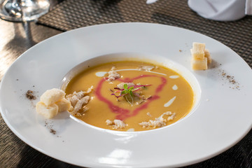  delicious lobster soup in white bowl
