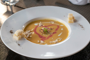  delicious lobster soup in white bowl