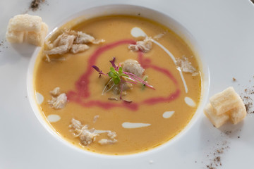  delicious lobster soup in white bowl