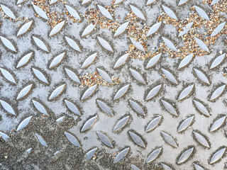 Background ground texture of metal on a bus station