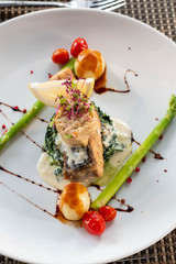 A grilled salmond on spinash