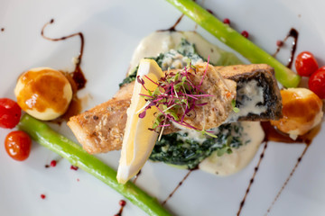 A grilled salmond on spinash