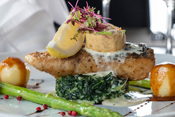 A grilled salmond on spinash