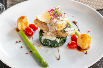 A grilled salmond on spinash