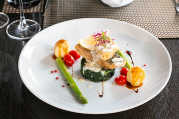 A grilled salmond on spinash