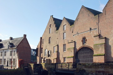 Fototapeta na wymiar s’Hertogenmolens: large water mills on the river Demer in Aarschot (Belgium). Built around 1510. View from the east