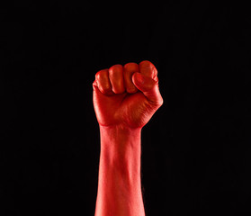 red bloody fist on a black background