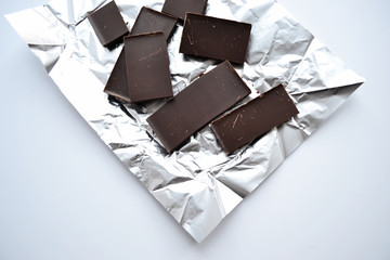 Chocolate bar in foil isolated on white background