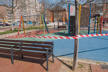 PALENCIA, SPAIN - MARCH 13, 2020: closed and empty children playgrounds in Spain because of coronavirus pandemic, covid-19, crisis