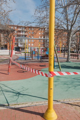 PALENCIA, SPAIN - MARCH 13, 2020: closed and empty children playgrounds in Spain because of coronavirus pandemic, covid-19, crisis