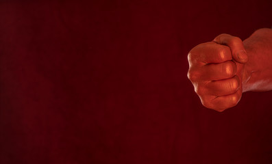 red bloody fist on a red background