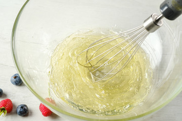 The process of making dough for pancakes.