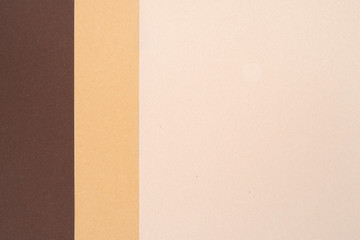 Background from recycled textured paper forming vertical shades of dark brown