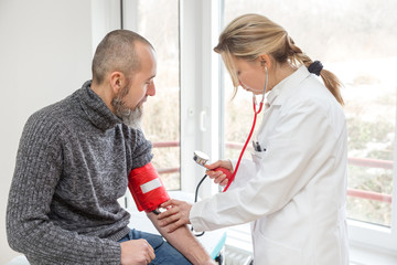 doctor is doing a examination with a male patient, corona virus concept or covid-19, sars-cov-2