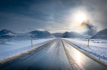 Iceland road in sunny winter day before storm