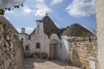 Fototapeta na wymiar Roof stones trulli of Alberobello. Puglia, southern Italy.
